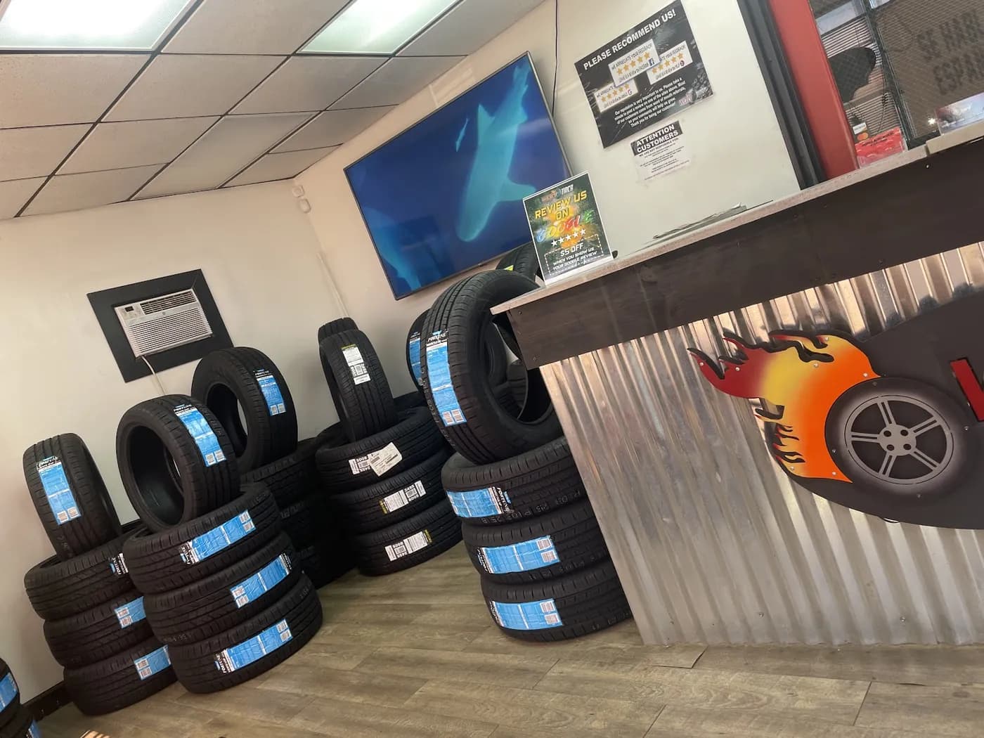 New tires stacked by the counter in our shop